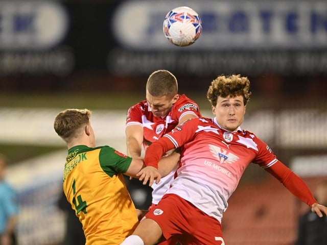 Owen Dodgson of Barnsley heads the ball during the Emirates FA Cup First Round match between Barnsley and Horsham at Oakwell Stadium.