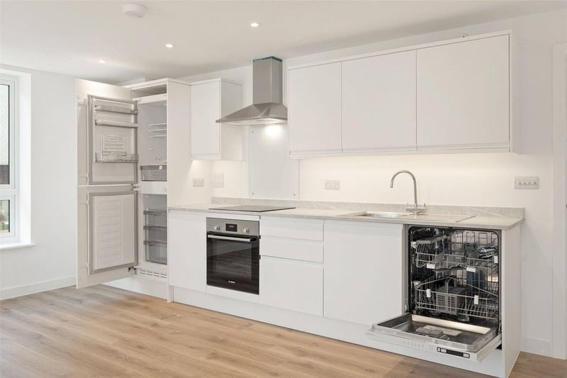 One two-bedroom apartment with balcony on the second floor is priced at £295,000. It has a light and spacious hallway and open-plan living / dining / kitchen area.
