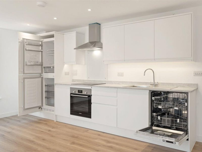 One two-bedroom apartment with balcony on the second floor is priced at £295,000. It has a light and spacious hallway and open-plan living / dining / kitchen area.