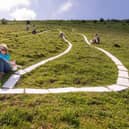 Volunteer gets stuck into the Long Man's spruce up
