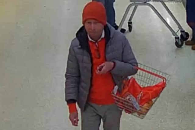 Do you recognise this man? Police want to speak to him after a woman's purse was stolen from her bag while she was in Horsham's Sainsbury's store