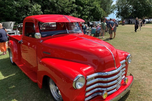A classic red Chevrolet pick up truck