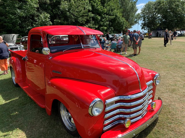 A classic red Chevrolet pick up truck