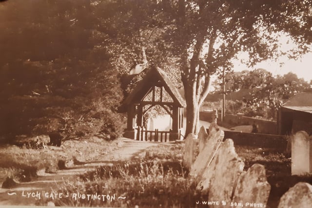A postcard of the lych-gate seen from St Peter and St Paul Church