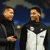 Igor Julio, who is unavailable for Brighton against Wolves, speaks with Joao Pedro before kick-off (Photo by Bryn Lennon/Getty Images)