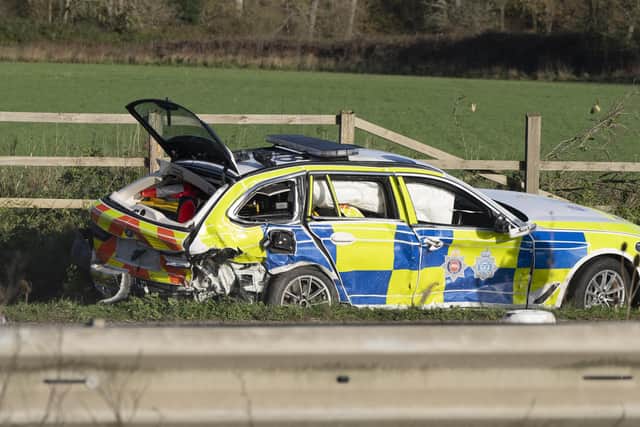 Pictures from the scene show a heavily damaged police car, which was involved in the incident.