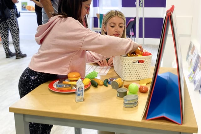 Visitors try out the healthy eating game (Credit: HDC)