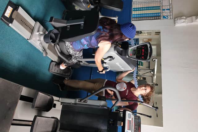 Marie Pickering, director and specialist instructor at Active Worthing, helping a client on a specialist machine in the Sidney Walter Centre