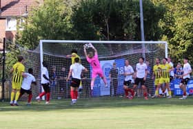 Goalmouth action in the Horsham YM-Haywards Heath game | Picture: Tim Hewlett