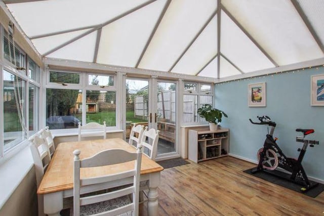 The kitchen/diner leads to this versatile conservatory at the back of the Honey Croft Court property. It lends itself to many uses and could even be used as a dining area. The double doors give access to the rear garden.