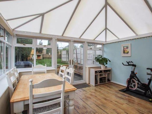The kitchen/diner leads to this versatile conservatory at the back of the Honey Croft Court property. It lends itself to many uses and could even be used as a dining area. The double doors give access to the rear garden.