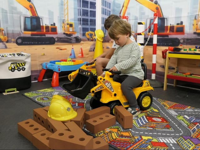 The construction site has diggers and building blocks