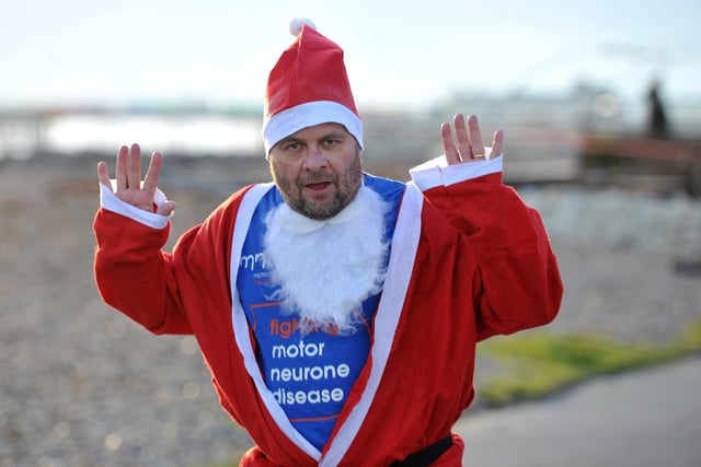 Santas on the Seafront run to raise money for MND. Pic S Robards SR2212102