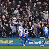Lewis Dunk of Brighton celebrates in front of Crystal Palace supporters after opening the scoring during the Premier League match between Brighton & Hove Albion and Crystal Palace at American Express Community Stadium on February 03, 2024 in Brighton, England. (Photo by Mike Hewitt/Getty Images)
