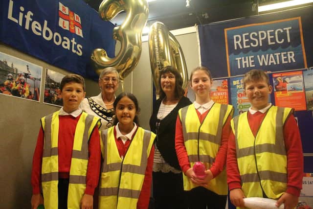 Mayor of Crawley, Councillor Jilly Hart (left) and Councillor Sue Mullins, Cabinet member for Public Protection and Community Engagement, with children from Seymour Primary School