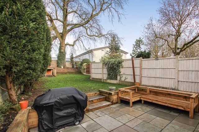 The lengthy, enclosed back garden is very pleasing on the eye. As well as a lawned area, there are trees and shrubs, plus a patio area with seating.