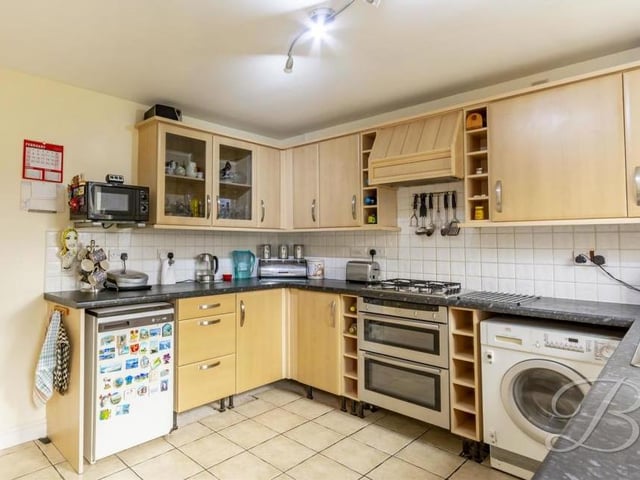 The kitchen is a good size and comes complete with matching cabinets, a work surface, integrated double oven, gas hobs, tiled splashback and extractor fan. There is also space and plumbing for a washing machine.