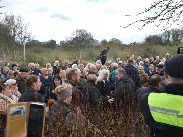 Public gathering by the gates of the Northeye site in Bexhill on Saturday April 1.