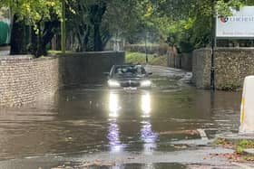 Photographer Eddie Mitchell captured the moment a car got submerged in the water in College Lane, Chichester