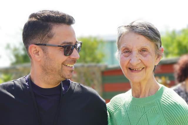 Nurse Christian Constantinescu with Guild Care resident Janet Geaves. Picture: Guild Care
