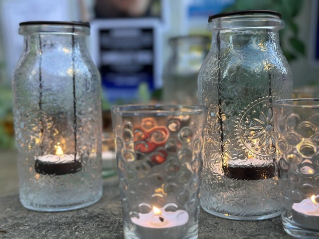 Candles lit by attendants paid tribute to 27-year-old Leonard Farruku.