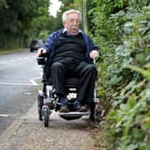 Wheelchair user Bill Smith faces daily problems getting around Southwater because of brambles growing over pavements, holes and dips in pavements, rubbish bins, and the lack of dropped kerbs for wheelchair users in places. SR23092901 Photo by S Robards/National World