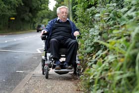 Wheelchair user Bill Smith faces daily problems getting around Southwater because of brambles growing over pavements, holes and dips in pavements, rubbish bins, and the lack of dropped kerbs for wheelchair users in places. SR23092901 Photo by S Robards/National World