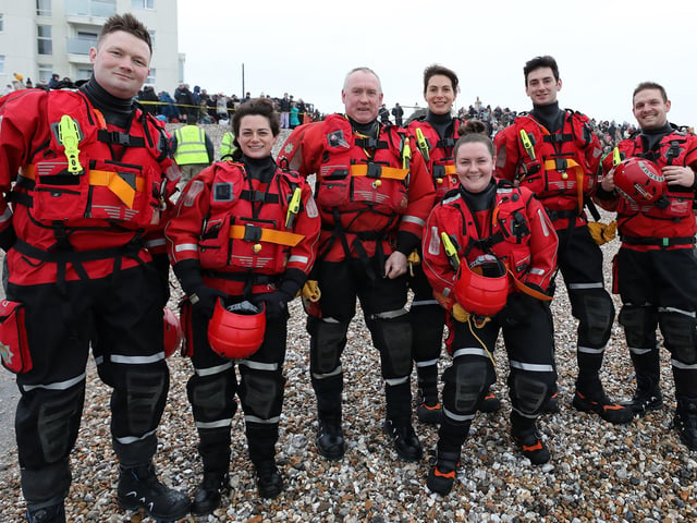 Some 385 people braved the ice cold sea water on New Year's Day 2024. Members of the West Sussex Fire and Rescue service on duty
