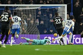 Kaoru Mitoma of Brighton & Hove Albion scores his team's first goal during the Premier League match between Brighton & Hove Albion FC and Chelsea FC at Amex Stadium on February 14, 2025 in Brighton, England. (Photo by Mike Hewitt/Getty Images)