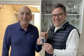 Horsham Rifle and Pistol Club club secretary, Tony Felgate (left), is presented with a medal by Horsham MP Jeremy Quin
