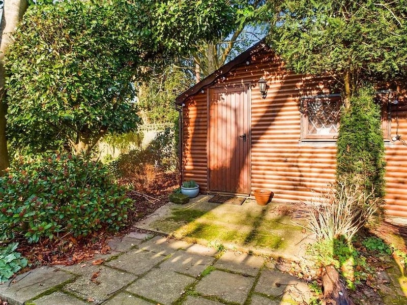 The garden has an insulated log cabin that could be used as a home office, additional bedroom or gym