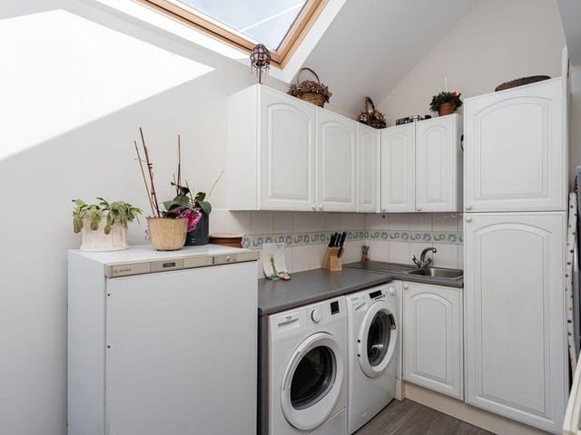 Refitted bespoke kitchen/breakfast room and utility room with integrated appliances