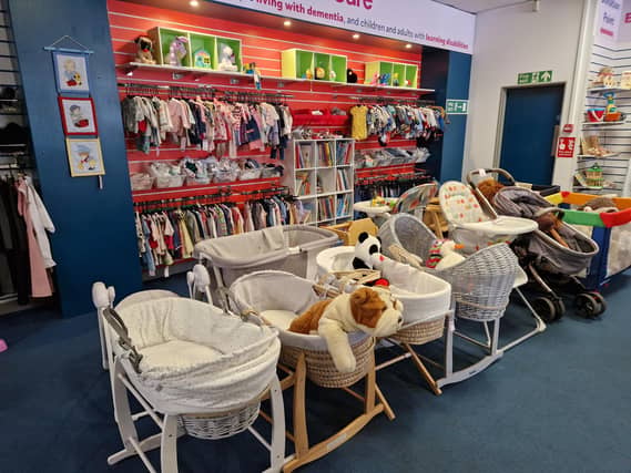 Inside Guild Care's new shop dedicated to children's toys, clothes and equipment, as influencer Jen Graham, known as Charity Shop Girl cuts the ribbon to officially open the Portland Road store