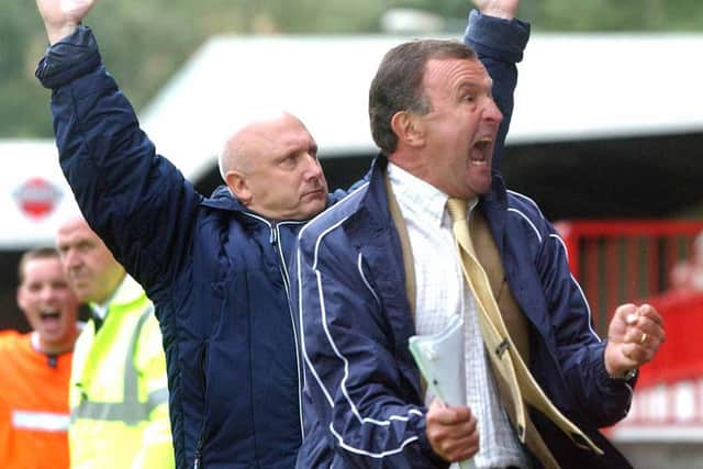 Hollins [right] was announced as manager of then Conference National side Crawley Town on November 21 2005 after the departure of Francis Vines. He remained with the club during the financial crisis that saw them docked ten points for going into administration, but left the club on October 30 2006 after Crawley had been beaten by Lewes in the final qualifying round for the FA Cup.
