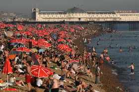 Looking towards the Palace Pier, beachgoers are seen enjoying the sun and the sea on the beach at Brighton, on the south coast of England on September 7, 2023. Picture by DANIEL LEAL/AFP via Getty Images