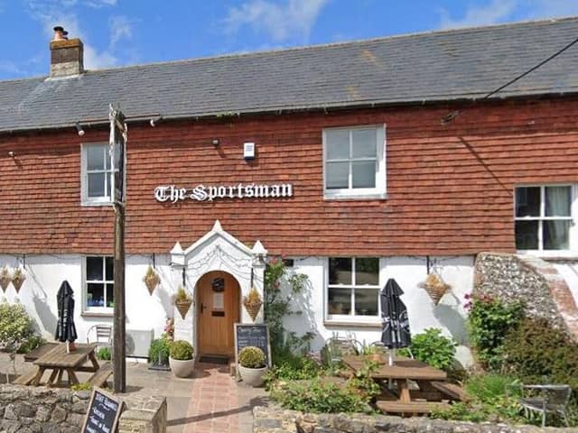 The Sportsman Inn at Amberley has reopened amid a battle by villagers to save the pub
