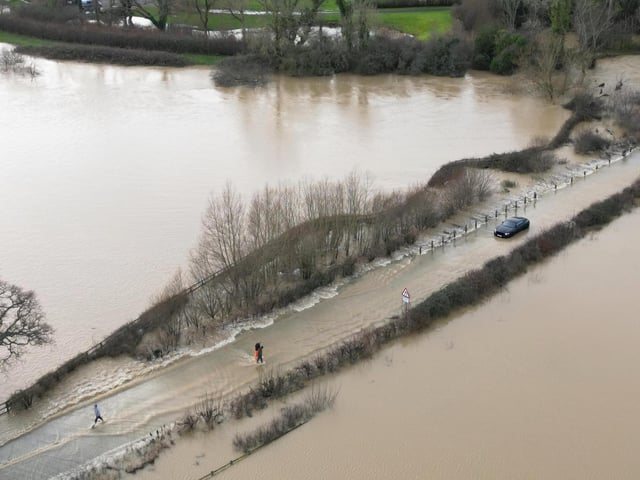 Members of the public helped drivers stuck in the flood water on the route from Billingshurst to Wisborough Green on Friday, January 5