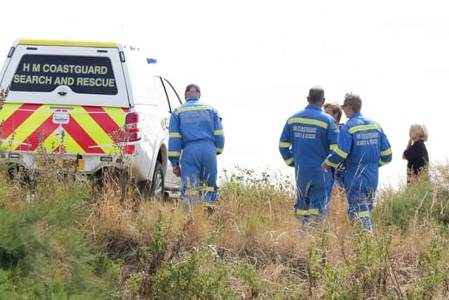 The Coastguard and police on Elmer Beach. Picture by Eddie Mitchell