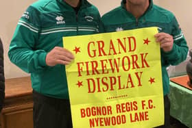 Rocks manager Robbie Blake and assistant coach Jamie Howell were happy to pose with a poster from the archives announcing the fireworks display
