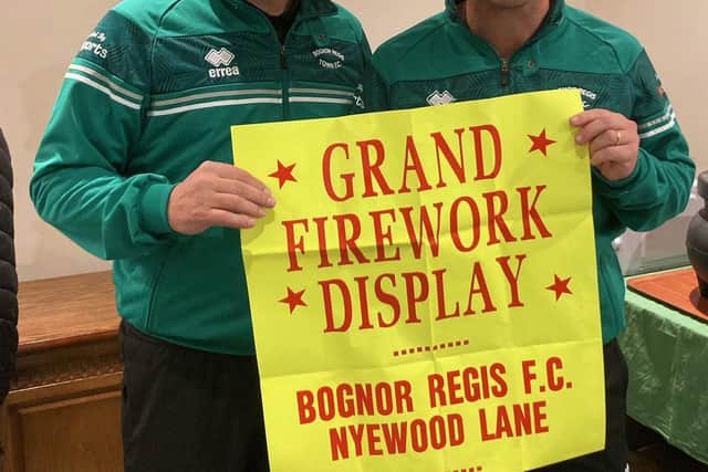 Rocks manager Robbie Blake and assistant coach Jamie Howell were happy to pose with a poster from the archives announcing the fireworks display