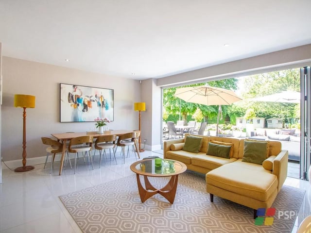 The kitchen/dining/family room is the heart of the home, offering an open plan area with bi-fold doors opening to the garden