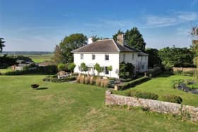 This elegant Georgian country house has wonderful views across the South Downs. It is on sale through Savills with a guide price of £2,750,000
