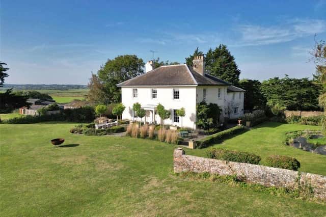 This elegant Georgian country house has wonderful views across the South Downs. It is on sale through Savills with a guide price of £2,750,000