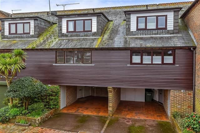 This modern town house with waterside garden is tucked away on a desirable private development in the heart of Arundel. It comes to the market with Cubitt & West, priced at £700,000.