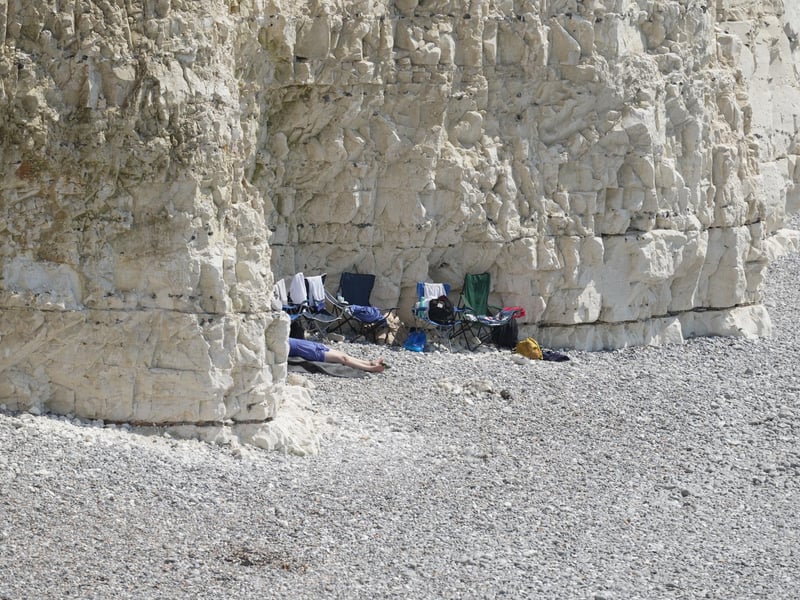 Shocking photos show sunbaskers standing near edge of cliffs at Birling Gap
