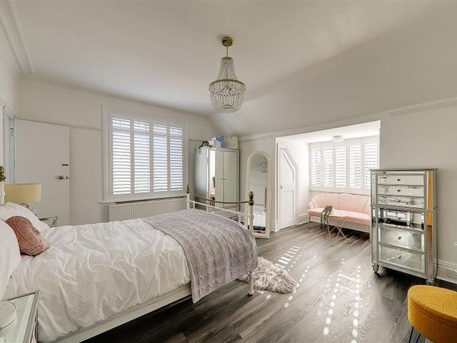 The master bedroom is double aspect with two walk-in storage cupboards