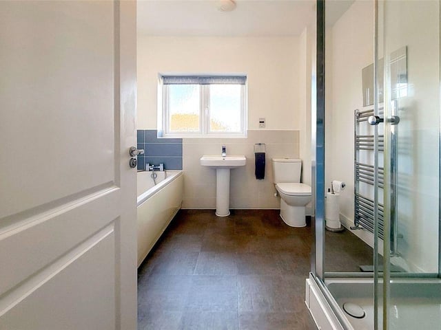 There is also a modern family bathroom, with bath and a separate shower