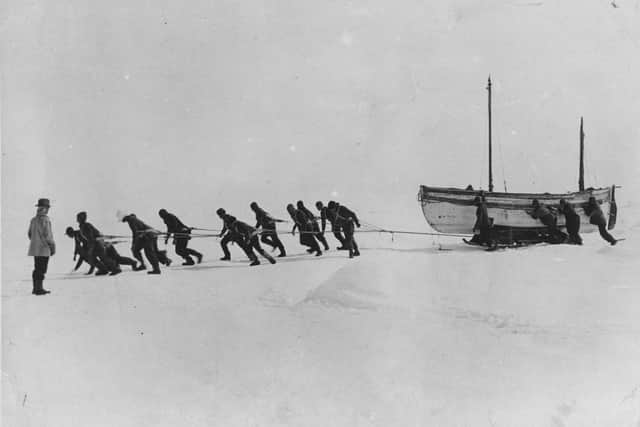 The Antarctica expedition team led by Sir Ernest Henry Shackleton pulling one of their lifeboats across the snow following the loss of the Endurance. Photo by Hulton Archive / Getty Images