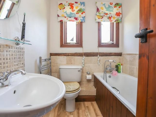 This five bed converted barn in Anmore Road, Denmead is on the market for £1.4m. It is listed on Zoopla by White & Guard Estate Agents.
