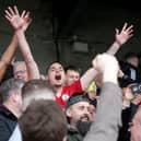 Crawley Town players celebrate in the stands after Saturday's historic win | Picture: Dov Friedmann